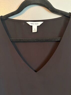 2 Tops for $17.00.  Black V-Neck Shift Top and Ruffled Neck Top. Like new